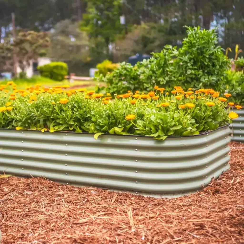 Vego Garden 17-inch modular metal raised garden bed in olive green installed in backyard